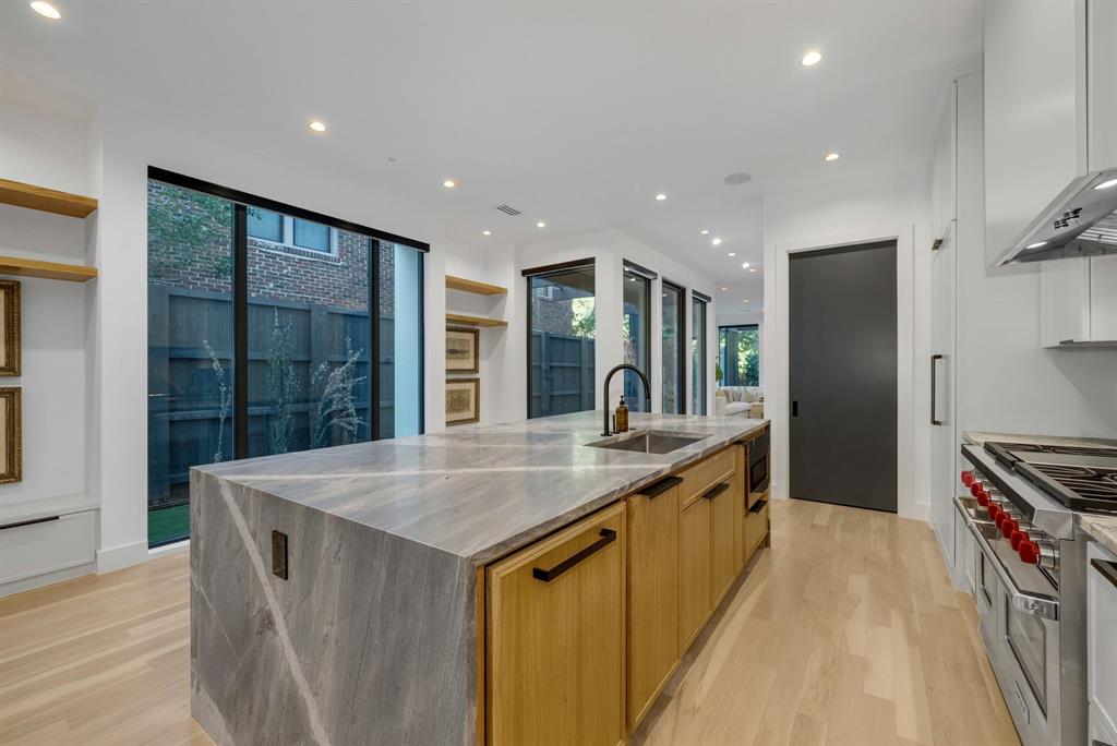 4214 Hawthorne Avenue Dallas, TX 75219 - Photo 2 of 39 a kitchen with stainless steel appliances granite countertop a sink and a stove