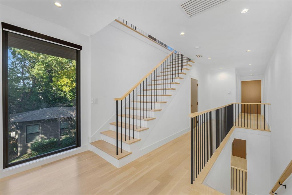 4214 Hawthorne Avenue Dallas, TX 75219 - Photo 23 of 39 a view of entryway and hall with wooden floor