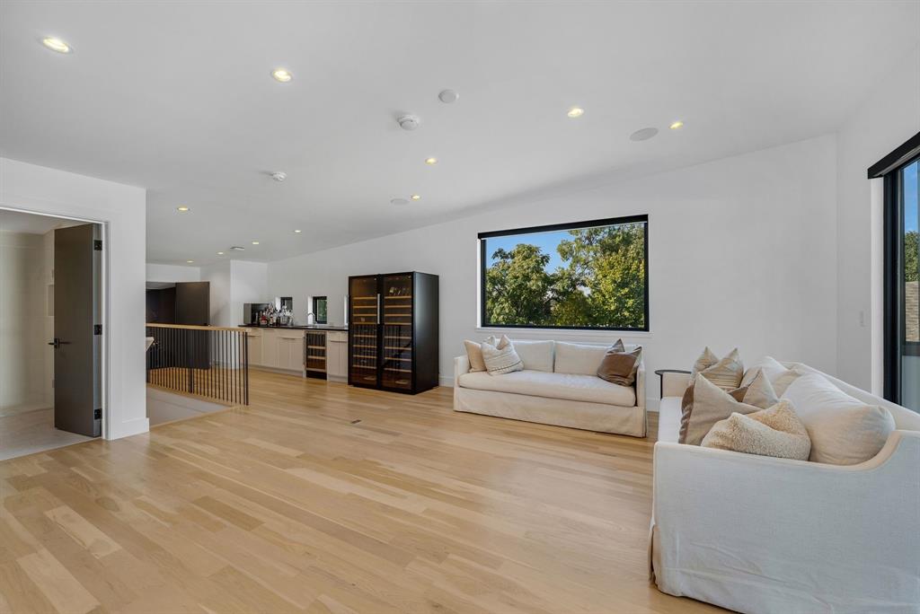 4214 Hawthorne Avenue Dallas, TX 75219 - Photo 25 of 39 a living room with furniture and a large window