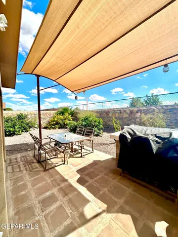 a view of balcony with couch and chairs