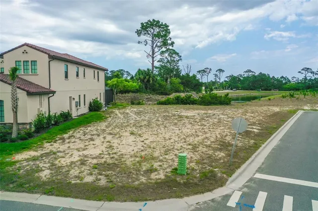 a view of a fountain in front of a house