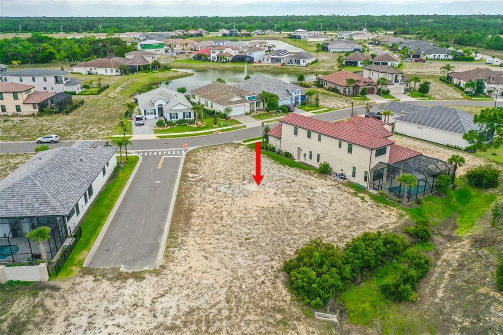 14 Rio Vista Drive Palm Coast, FL 32137 - Photo 16 of 32 an aerial view of a house with a garden and lake view