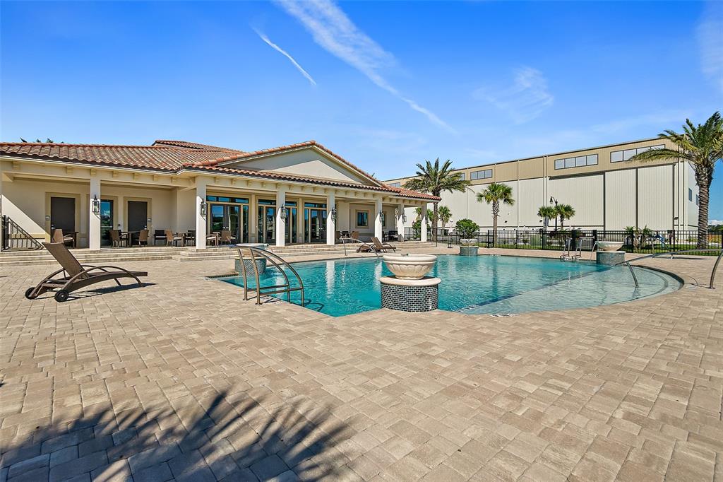 14 Rio Vista Drive Palm Coast, FL 32137 - Photo 27 of 32 a view of a house with swimming pool and sitting area