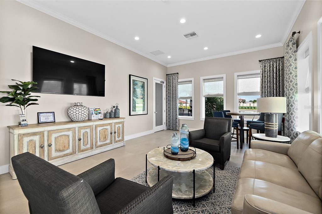 14 Rio Vista Drive Palm Coast, FL 32137 - Photo 30 of 32 a living room with furniture kitchen view and a flat screen tv