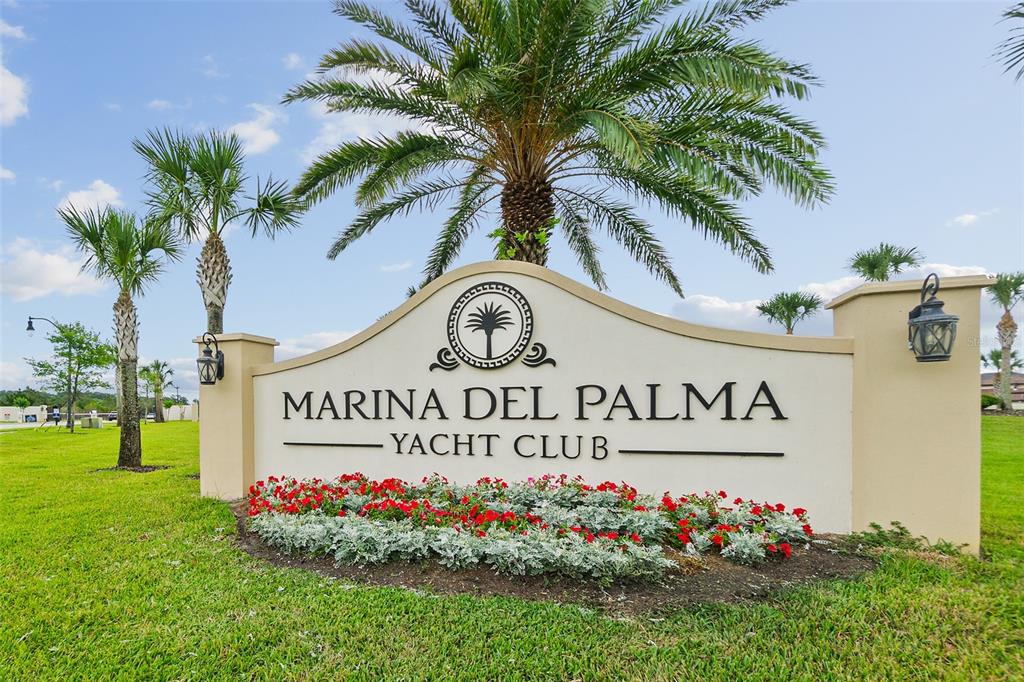 14 Rio Vista Drive Palm Coast, FL 32137 - Photo 3 of 32 a sign that is in front of flowers