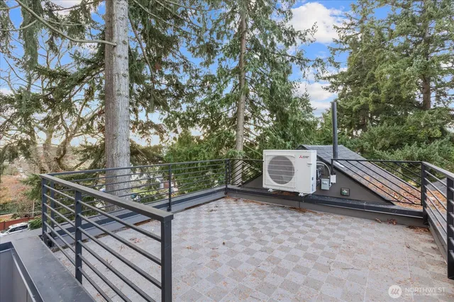 a view of a two chairs and table in the balcony