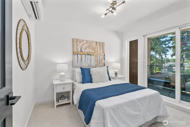 a bed room with a bed mirror and a window