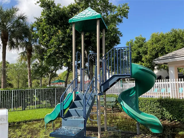 a front view of a house with a yard table and chairs