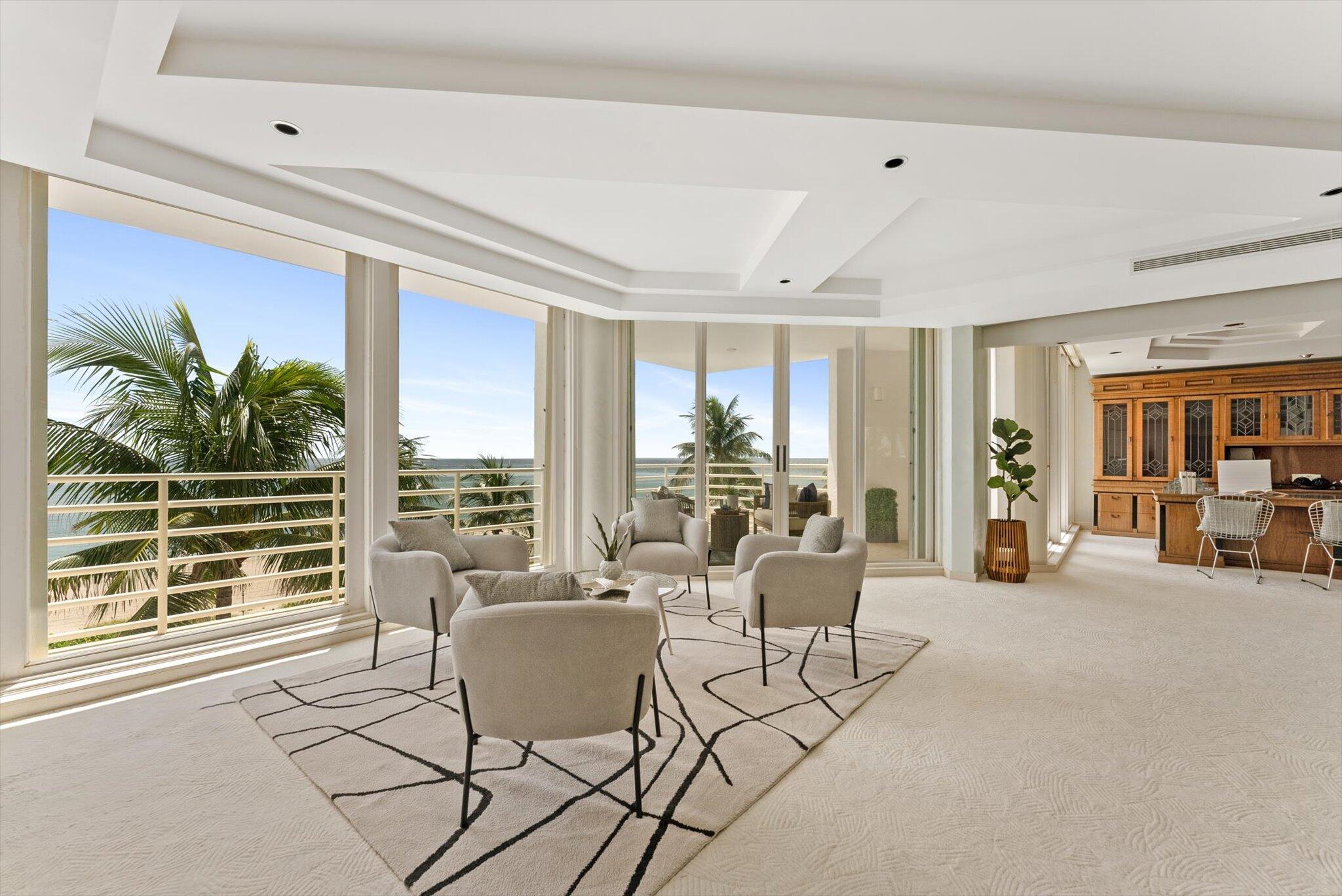 800 South Ocean Boulevard, Unit 303 Boca Raton, FL 33432 - Photo 14 of 49 a living room with furniture and large windows