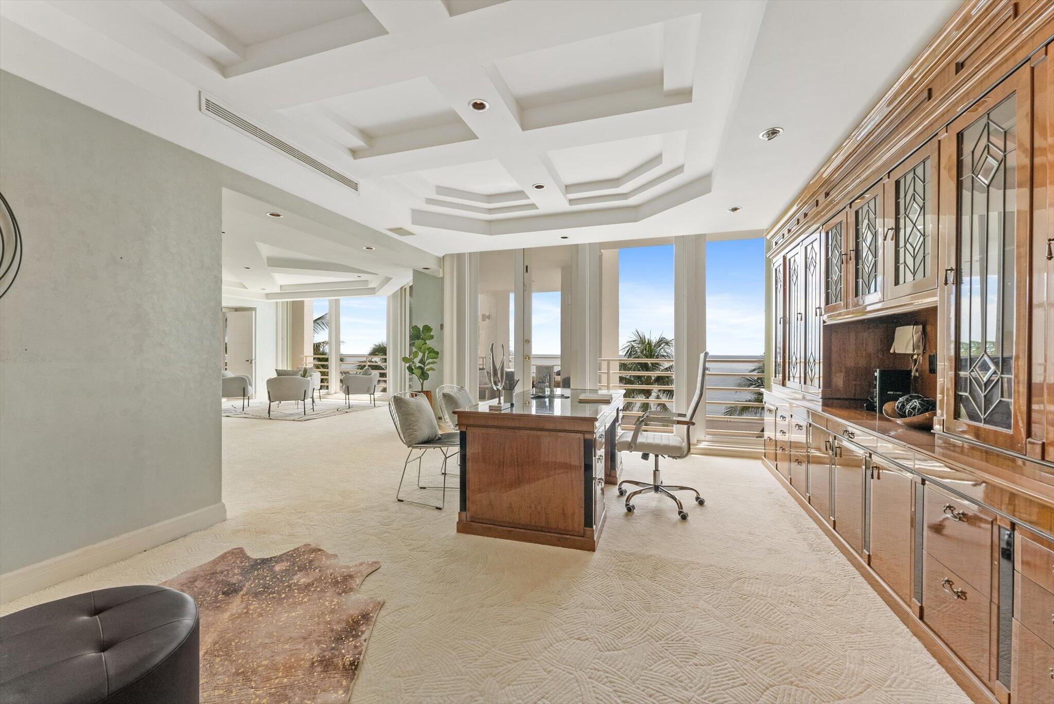 800 South Ocean Boulevard, Unit 303 Boca Raton, FL 33432 - Photo 15 of 49 a living room with furniture and a flat screen tv