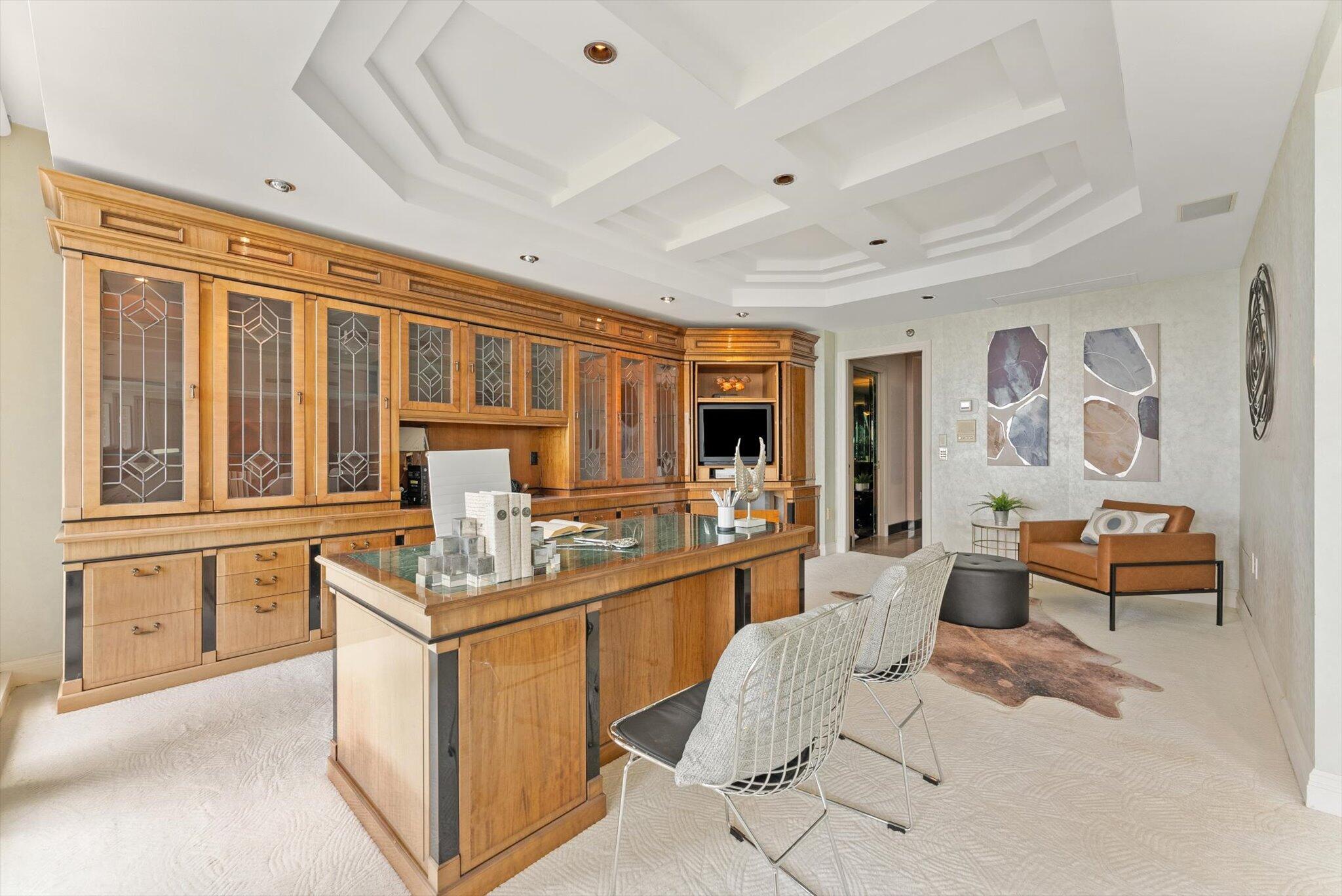 800 South Ocean Boulevard, Unit 303 Boca Raton, FL 33432 - Photo 16 of 49 a room with stainless steel appliances kitchen island granite countertop a sink and cabinets