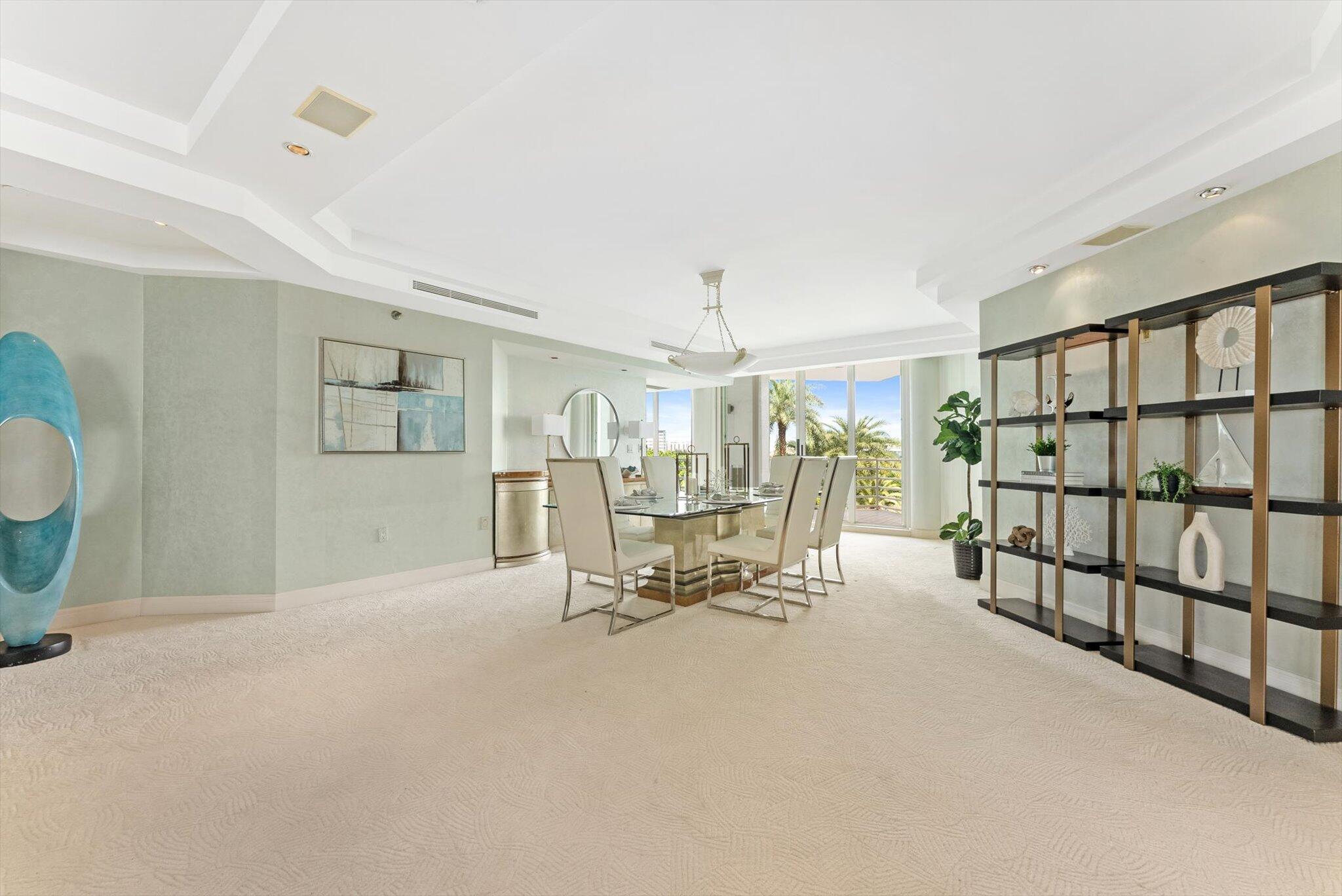 800 South Ocean Boulevard, Unit 303 Boca Raton, FL 33432 - Photo 4 of 49 a view of a livingroom with furniture and a book shelf