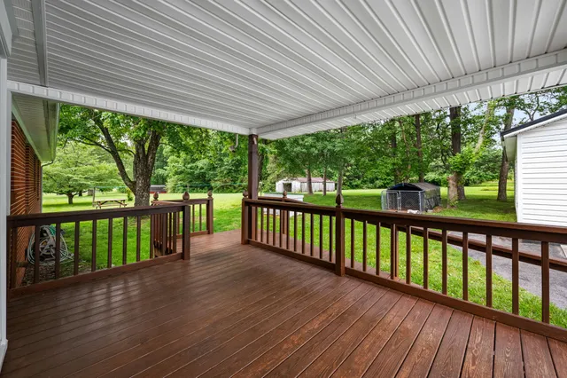 a porch with wooden floor in outdoor space