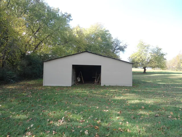 a backyard of a house with lots of green space