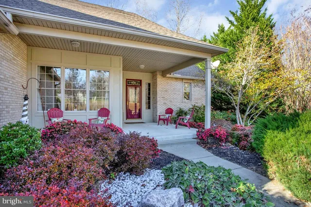 a view of a house with a flower garden