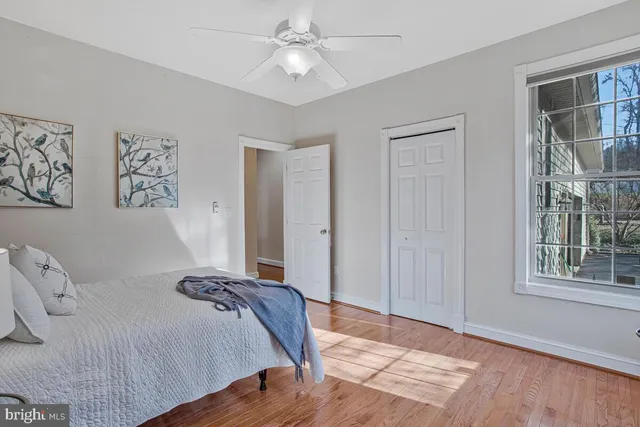 a bed room with a bed and a window