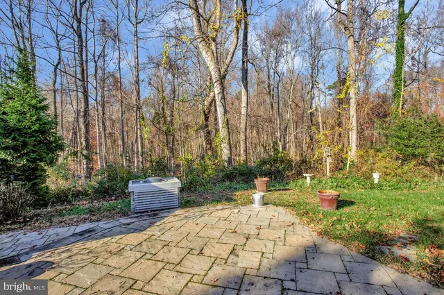 a pathway of a house with a yard