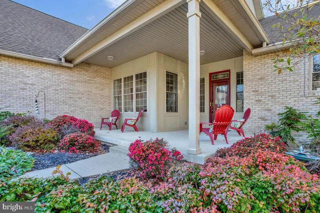 a view of a chairs and table in a patio