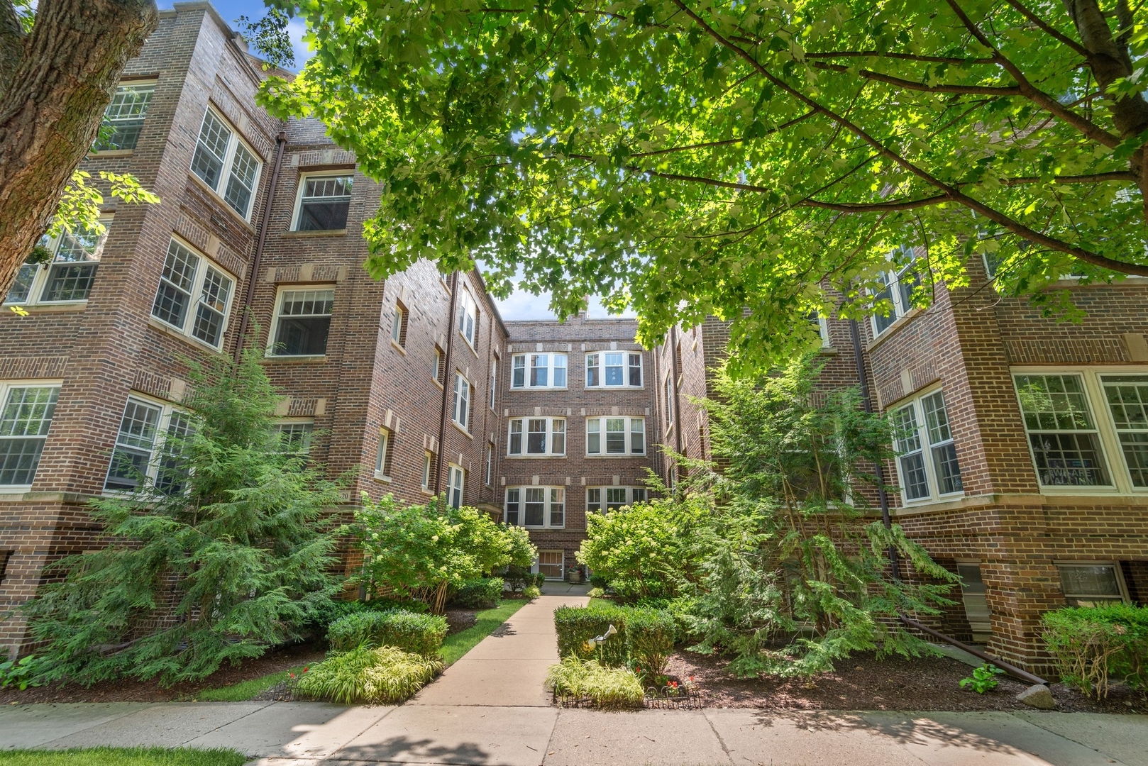 422 Hamilton Street, Unit 1 Evanston, IL 60202 - Photo 1 of 23 a front view of a multi story residential apartment buildings