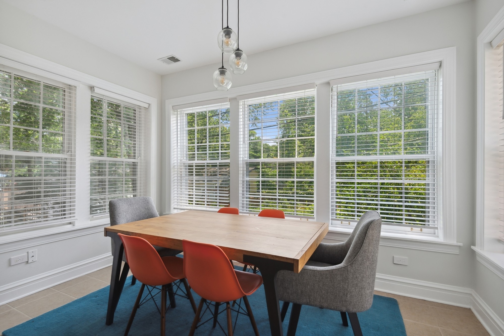 422 Hamilton Street, Unit 1 Evanston, IL 60202 - Photo 14 of 23 a view of a dining room with furniture and windows