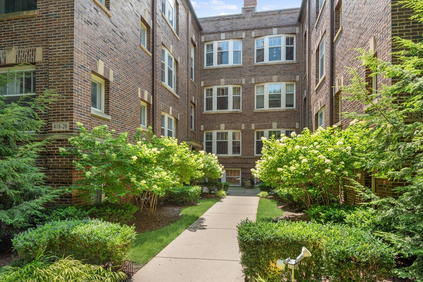 422 Hamilton Street, Unit 1 Evanston, IL 60202 - Photo 3 of 23 a view of a building with garden