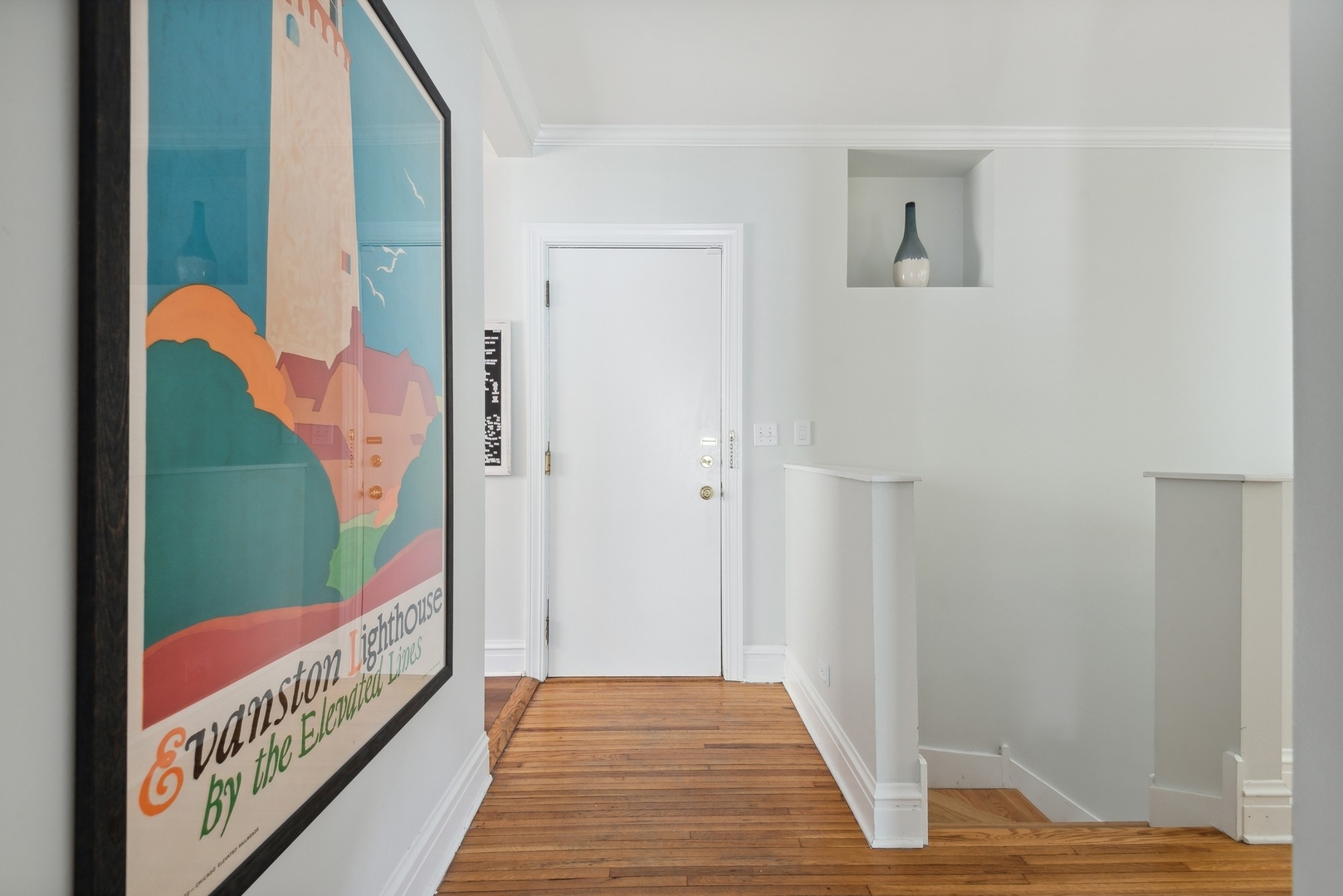 422 Hamilton Street, Unit 1 Evanston, IL 60202 - Photo 4 of 23 a view of a hallway with wooden floor and a living room