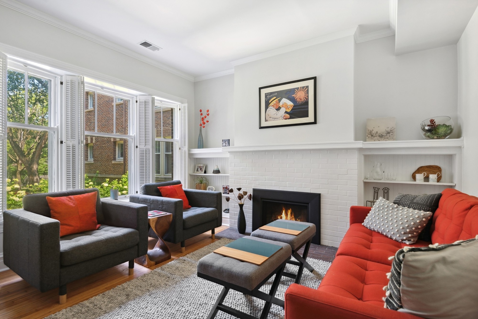 422 Hamilton Street, Unit 1 Evanston, IL 60202 - Photo 6 of 23 a living room with furniture fireplace and a large window