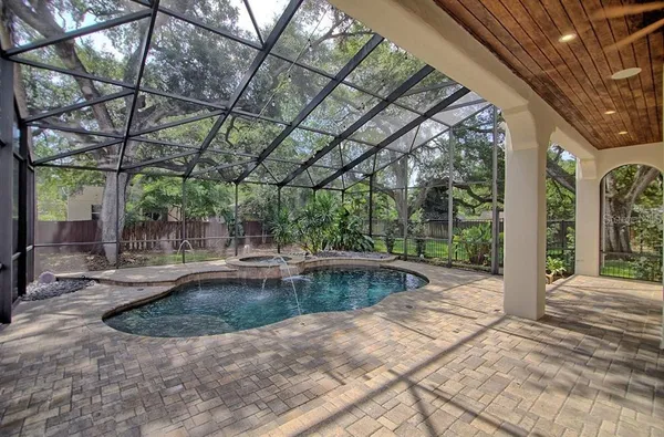a view of a swimming pool with a patio