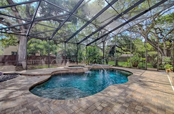 a view of a swimming pool with a patio
