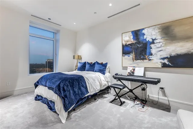a spacious bathroom with a granite countertop sink and a mirror