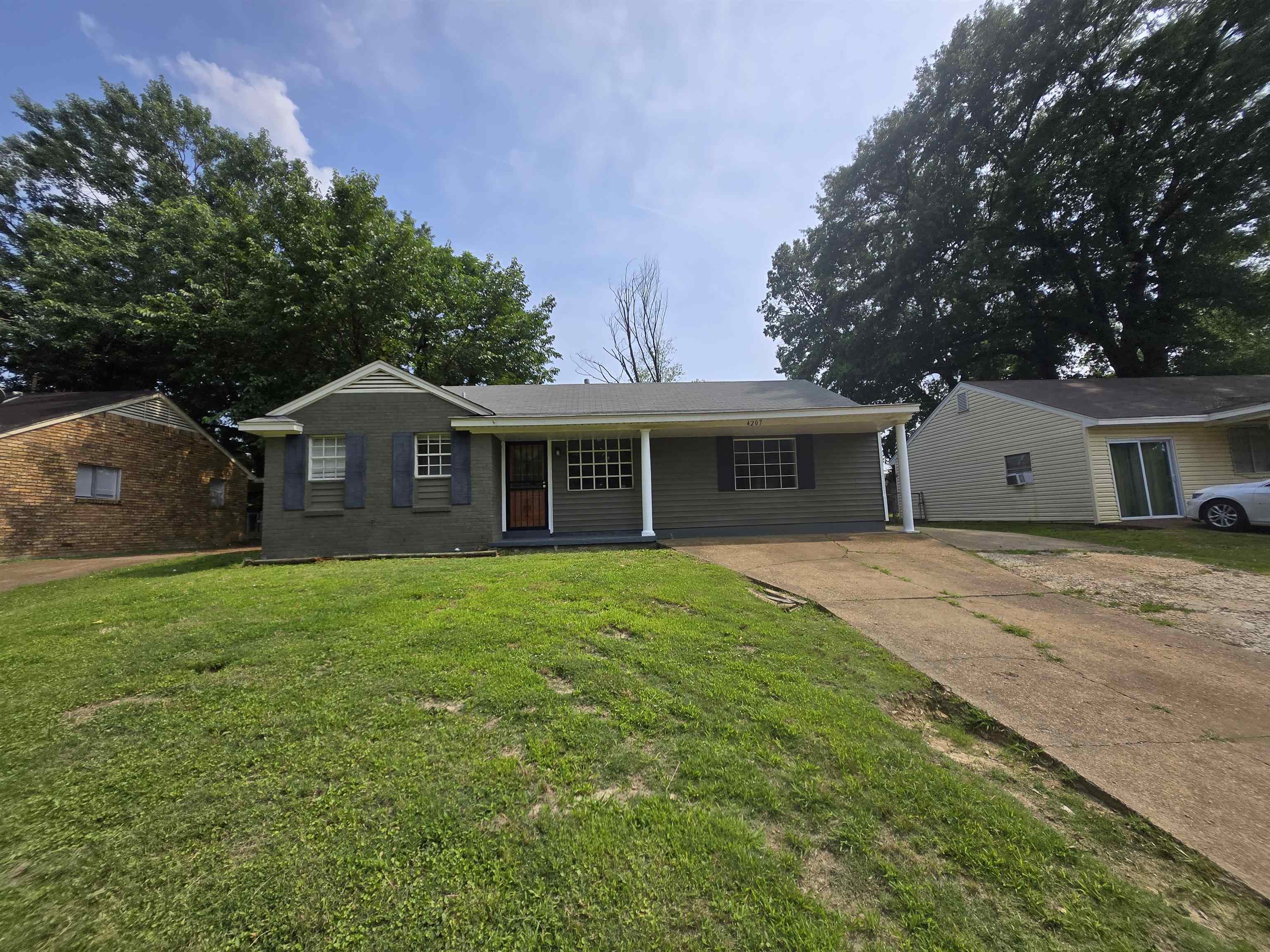4207 Kenosha Road Memphis, TN 38118 - Photo 1 of 24 Ranch-style house featuring driveway and a front lawn