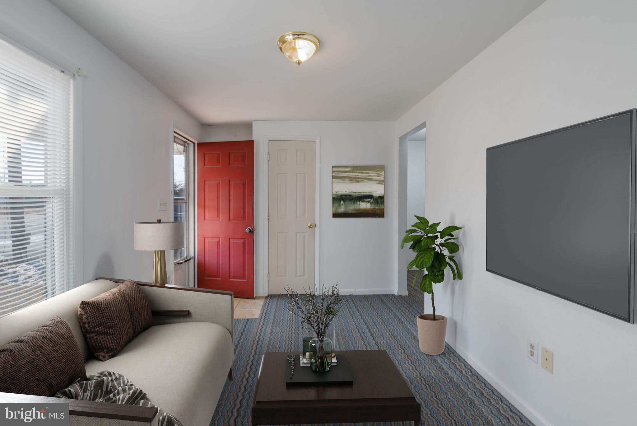 30071 Vines Creek Road Dagsboro, DE 19939 - Photo 2 of 15 a living room with furniture and a potted plant
