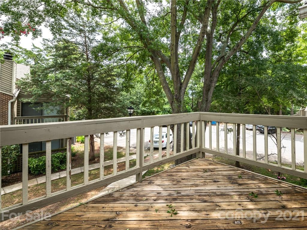 1604 Sharon Road West, Unit 24 Charlotte, NC 28210 - Photo 2 of 25 a view of a wooden deck