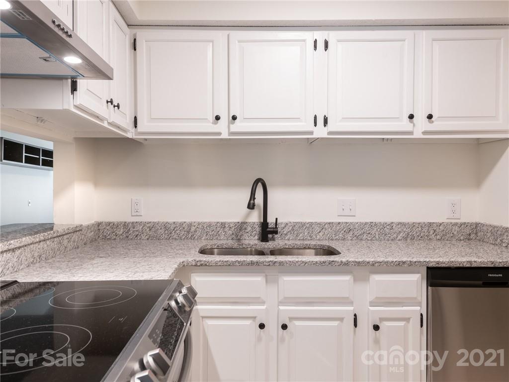 1604 Sharon Road West, Unit 24 Charlotte, NC 28210 - Photo 12 of 25 a kitchen with a sink and cabinets