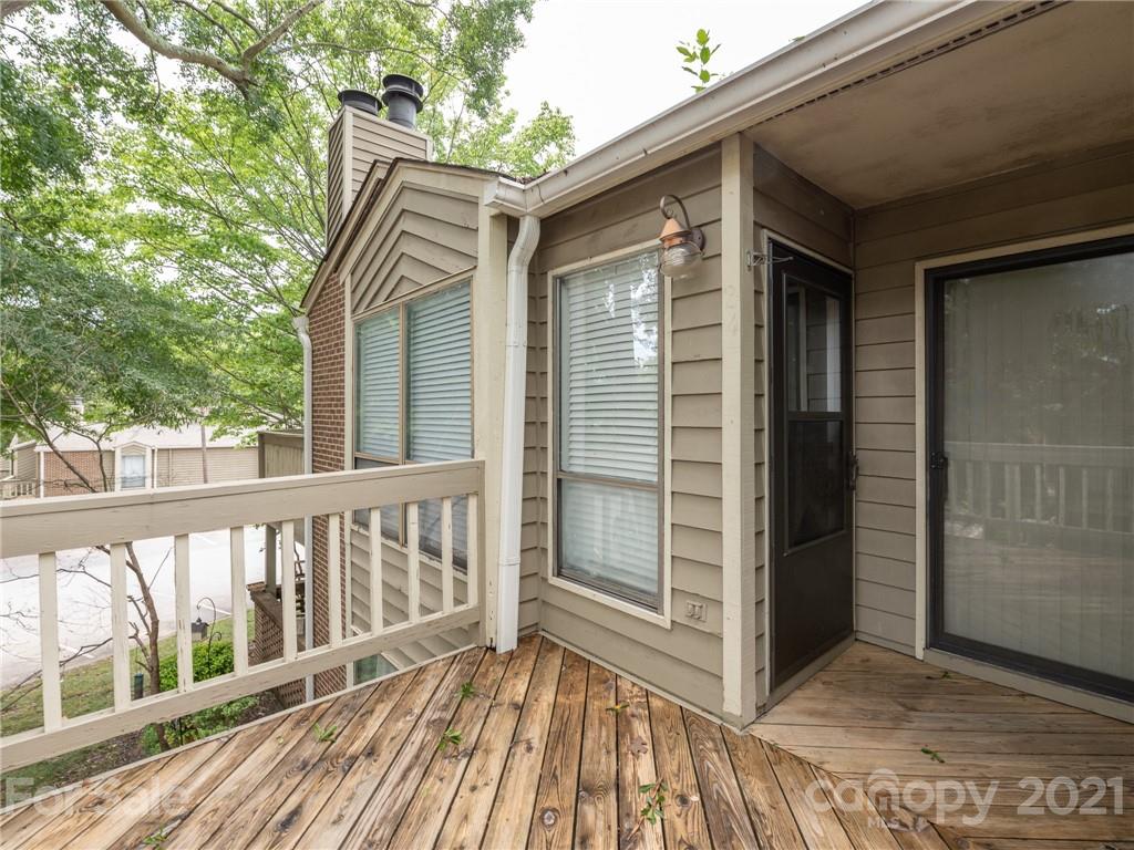 1604 Sharon Road West, Unit 24 Charlotte, NC 28210 - Photo 3 of 25 a view of wooden house with a balcony