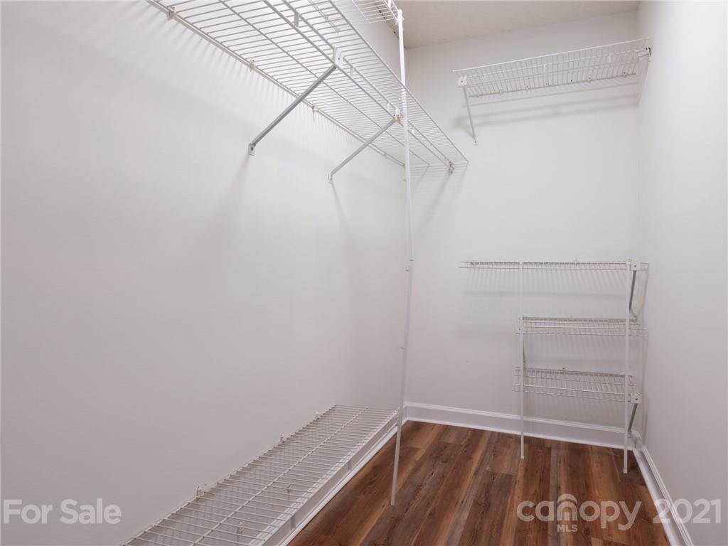 1604 Sharon Road West, Unit 24 Charlotte, NC 28210 - Photo 22 of 25 a view of a room with racks on the wall
