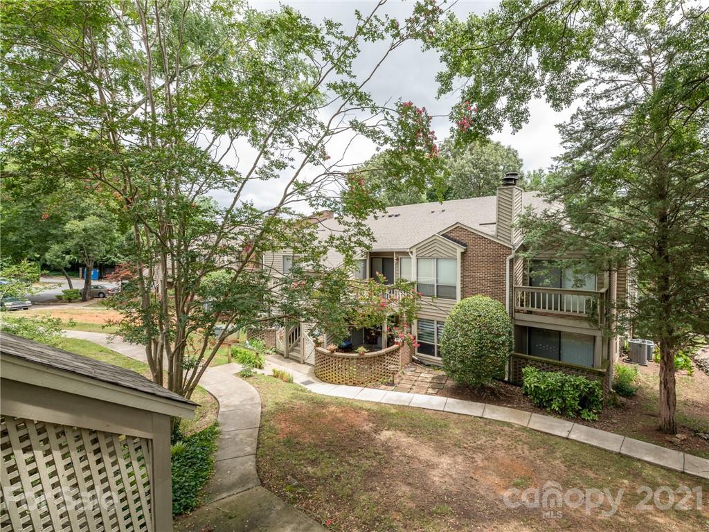 1604 Sharon Road West, Unit 24 Charlotte, NC 28210 - Photo 23 of 25 a front view of a house with garden