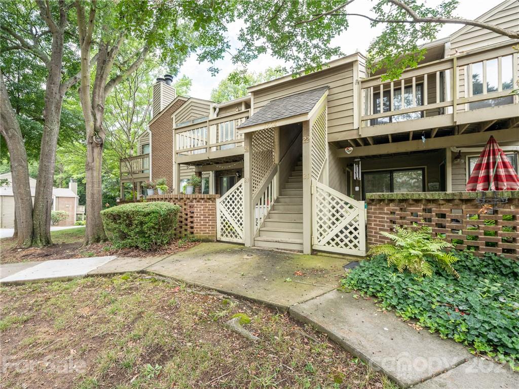 1604 Sharon Road West, Unit 24 Charlotte, NC 28210 - Photo 25 of 25 a front view of a house with a garage