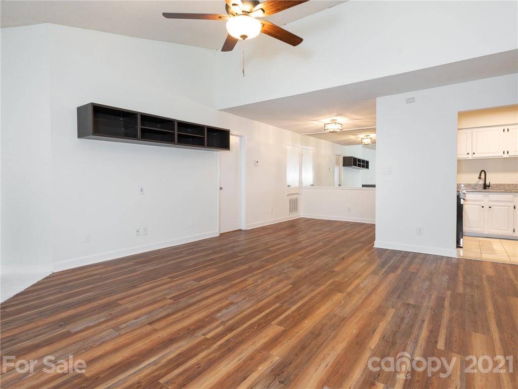 1604 Sharon Road West, Unit 24 Charlotte, NC 28210 - Photo 5 of 25 a view of empty room with wooden floor