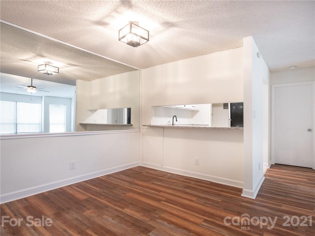 1604 Sharon Road West, Unit 24 Charlotte, NC 28210 - Photo 10 of 25 a view of empty room with wooden floor