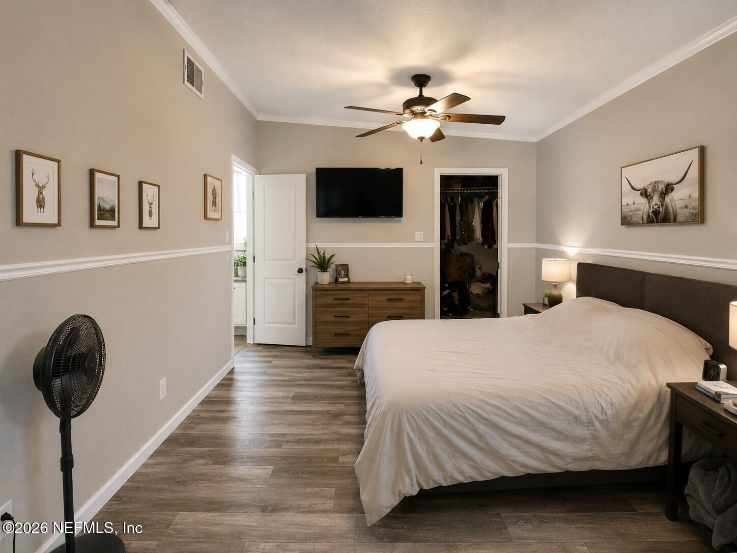 124 Jack Road Palatka, FL 32177 - Photo 6 of 18 a bedroom with a bed and a chandelier