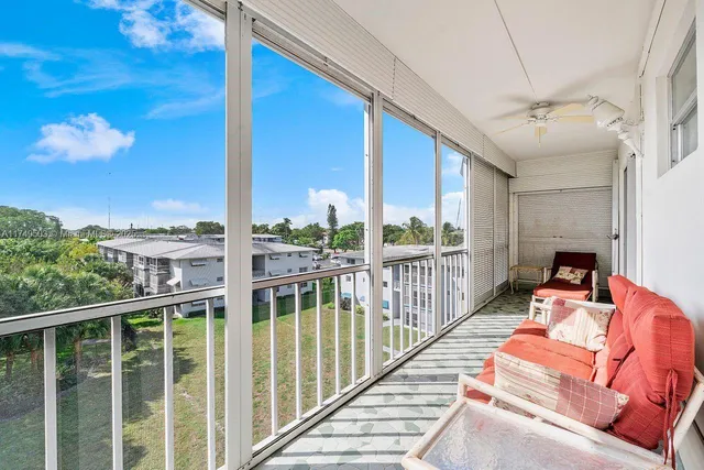a view of balcony with furniture