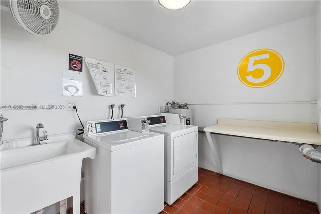 a view of a sink and cabinets in a room