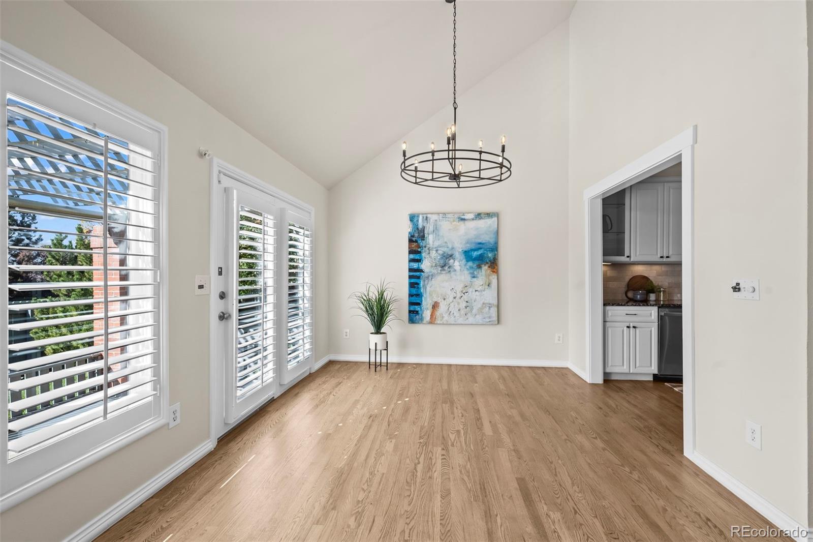 7264 Siena Way, Unit C Boulder, CO 80301 - Photo 15 of 48 a view of empty room with wooden floor and fan