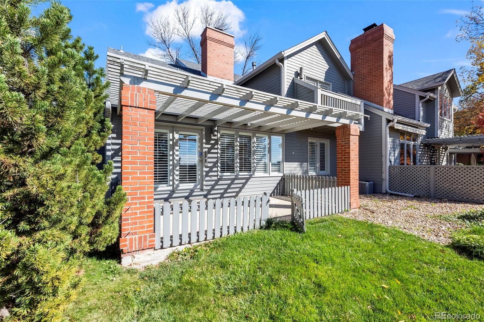 7264 Siena Way, Unit C Boulder, CO 80301 - Photo 21 of 48 front view of a house with a yard