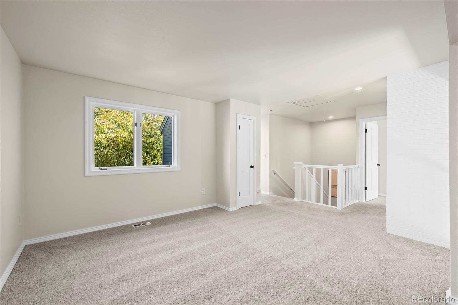 7264 Siena Way, Unit C Boulder, CO 80301 - Photo 27 of 48 a view of an empty room with a window