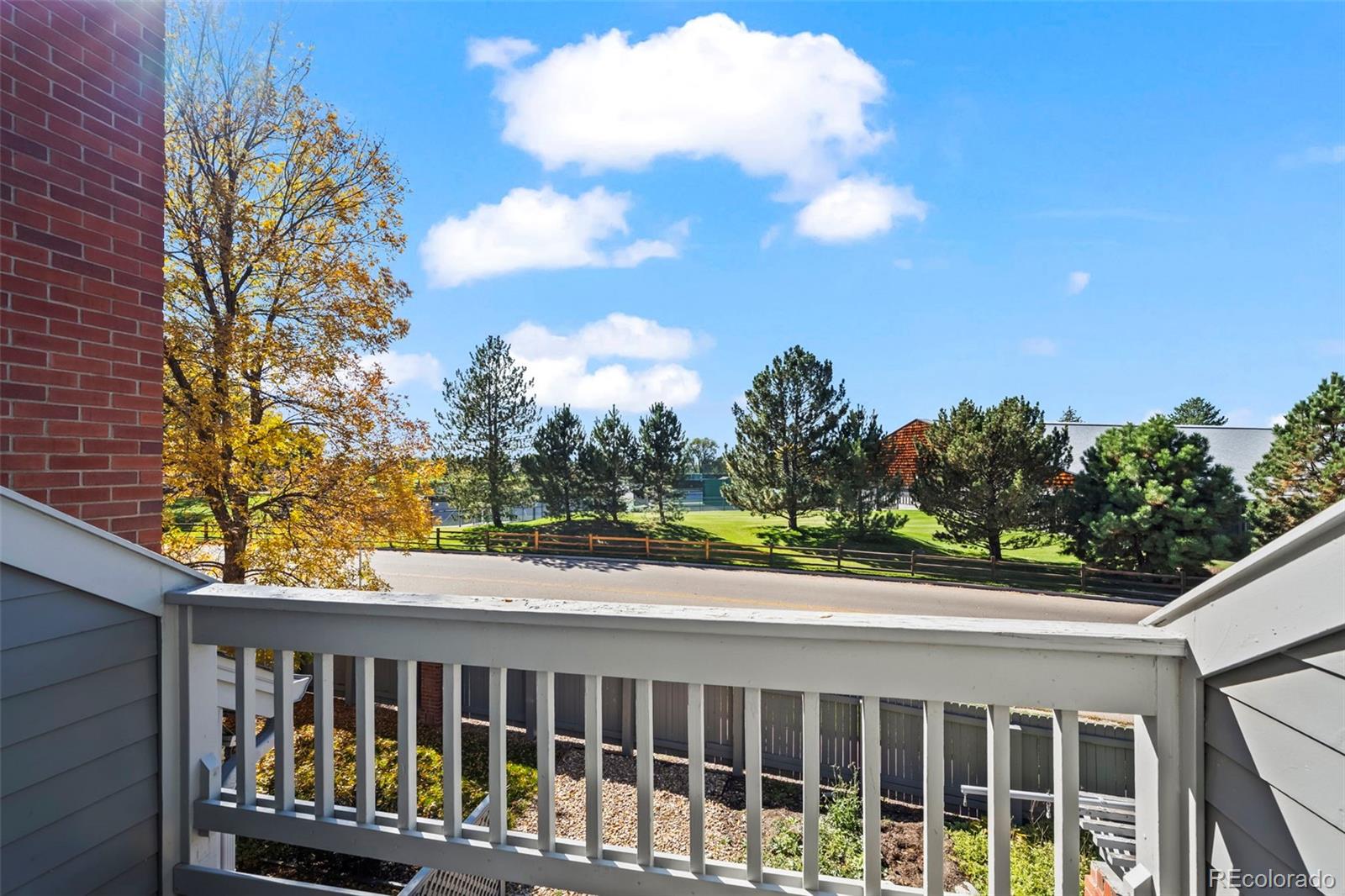7264 Siena Way, Unit C Boulder, CO 80301 - Photo 29 of 48 a view of a wooden deck with sunset