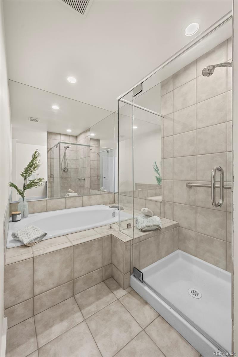 7264 Siena Way, Unit C Boulder, CO 80301 - Photo 32 of 48 a bathroom with a granite countertop bathtub shower and sink