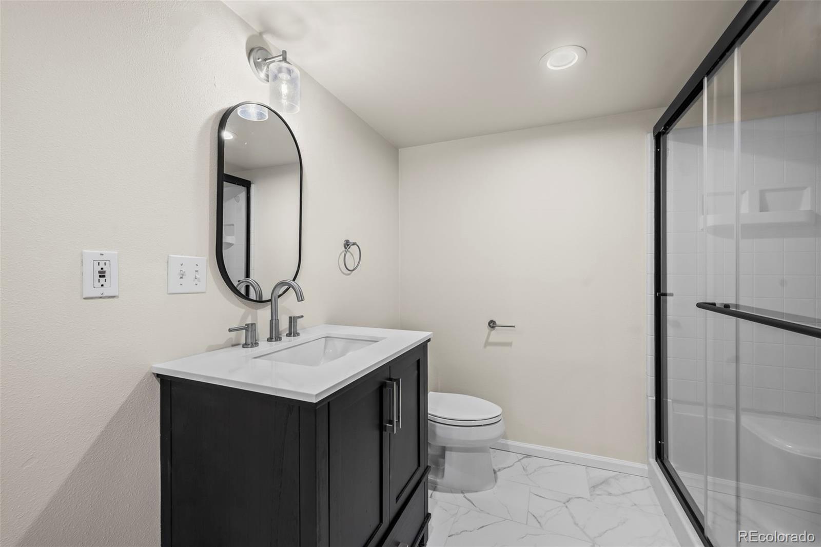 7264 Siena Way, Unit C Boulder, CO 80301 - Photo 39 of 48 a bathroom with a toilet sink and mirror