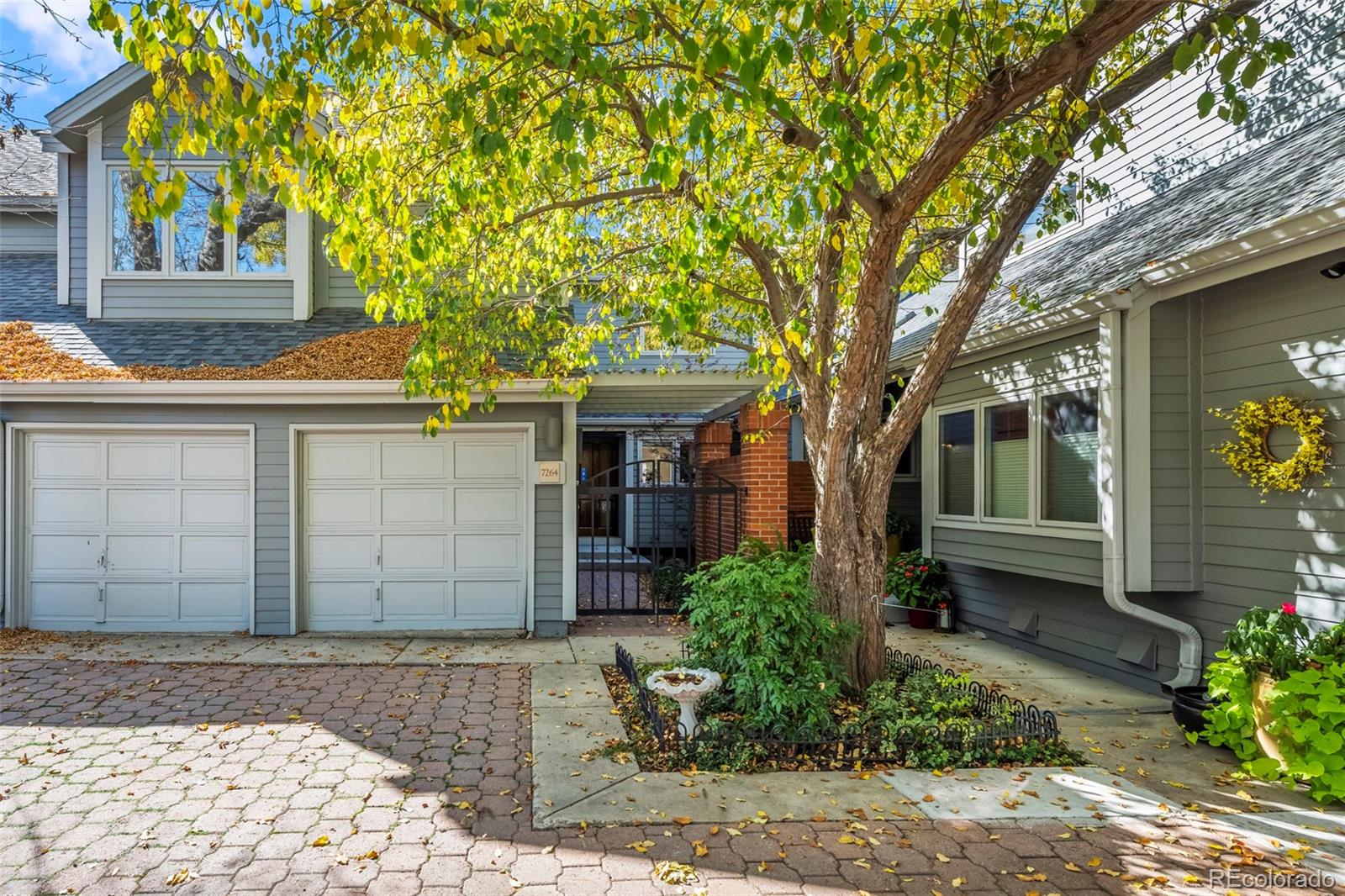 7264 Siena Way, Unit C Boulder, CO 80301 - Photo 4 of 48 a front view of a house with a yard and garage